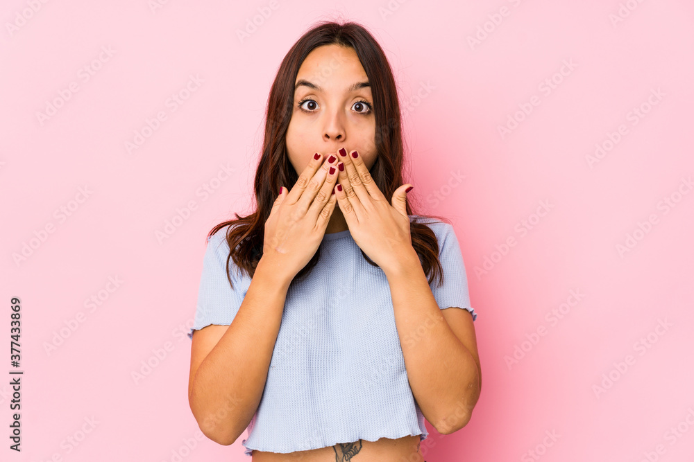Young mixed race hispanic woman isolated shocked, covering mouth with hands, anxious to discover something new. Young mixed race hispanic woman isolated shocked, covering mouth with hands, anxious to discover something new.