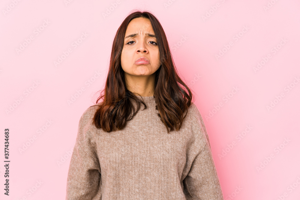 Young mixed race hispanic woman isolated sad, serious face, feeling miserable and displeased. Young mixed race hispanic woman isolated sad, serious face, feeling miserable and displeased.
