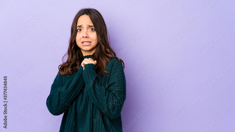 Young mixed race hispanic woman isolated scared and afraid. Young mixed race hispanic woman isolated scared and afraid.