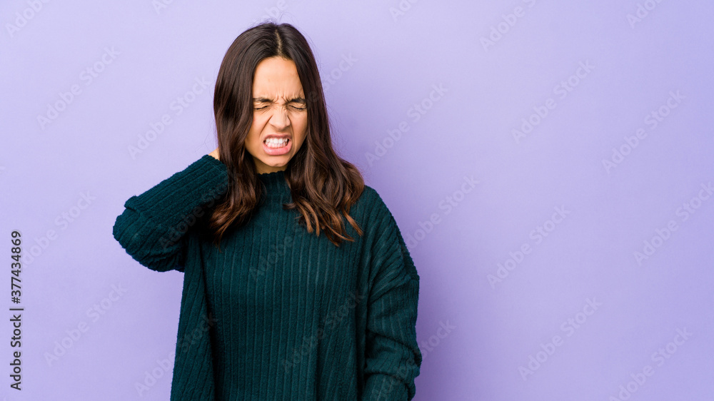 Fototapeta premium Young mixed race hispanic woman isolated suffering neck pain due to sedentary lifestyle.