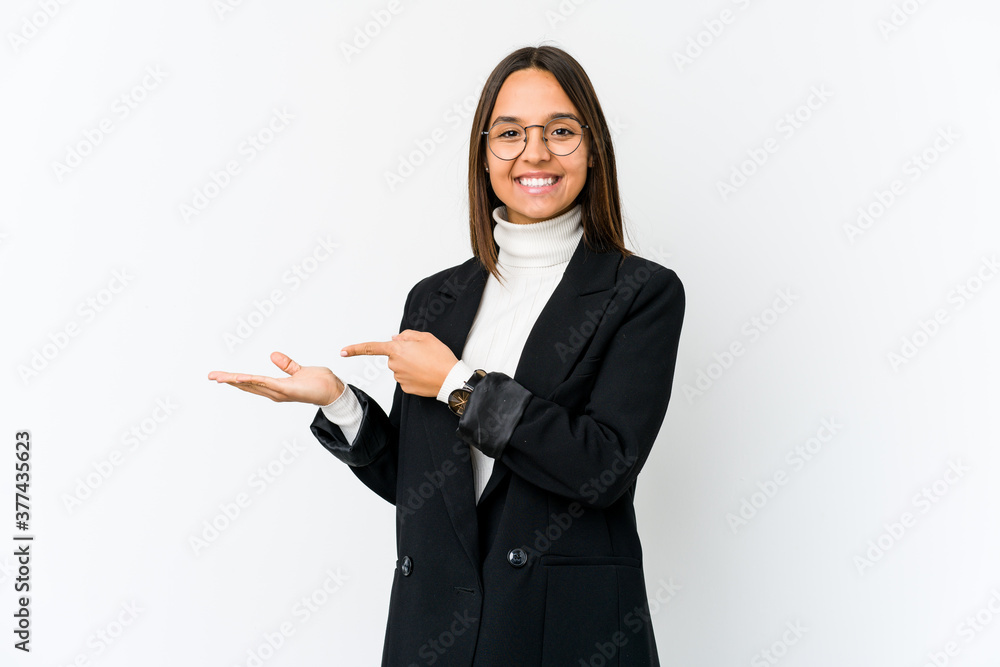 Young mixed race business woman isolated on white background excited holding a copy space on palm. Young mixed race business woman isolated on white background excited holding a copy space on palm.
