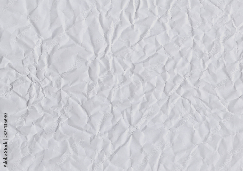 Closeup crumpled light grey paper  texture background, texture. Grey paper sheet board with space for text ,pattern or abstract design backdrop.