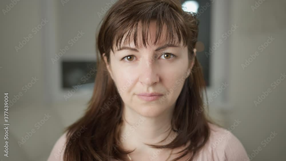 portrait of a smiling woman looking at the camera, close up, moving camera portrait of a smiling woman looking at the camera, close up, moving camera
