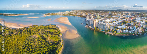 Panoramic aerial view of mangroves and real estate along the banks of the Maroochy River in Queensla photo