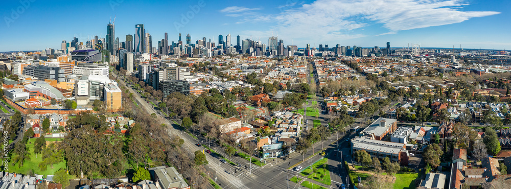 Aerial panorama of North Melbourne with Melbourne CBD in the distance