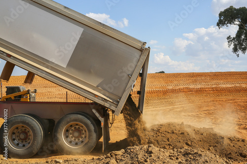 truck tipping soil on a construction site