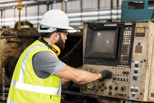 European male labor working in the factory. © JuYochi