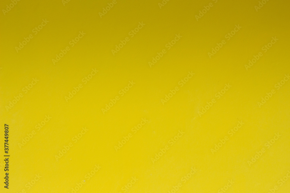 Obraz premium Yellow background with shadow on top