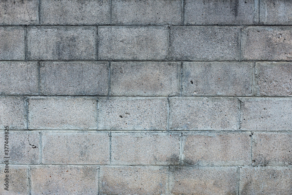 Concrete block slits into a gray background Concrete block slits into a gray background