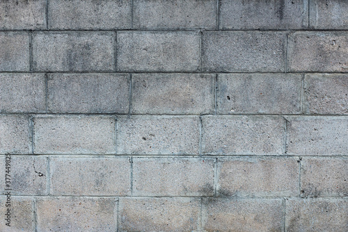 Concrete block slits into a gray background