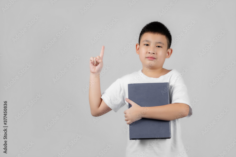 Asian boys studio shot portrait on gray background Asian boys studio shot portrait on gray background