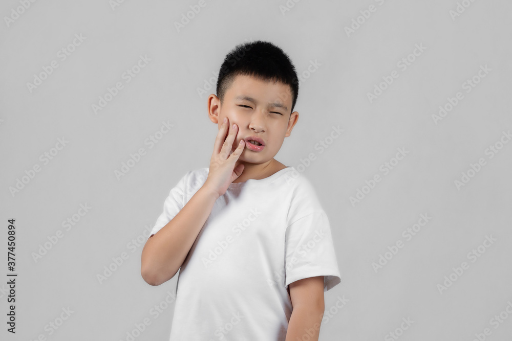 Asian boys studio shot portrait on gray background Asian boys studio shot portrait on gray background