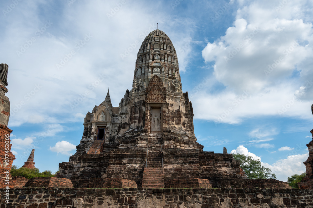 Ayutthaya / Thailand / August 8, 2020 : Wat Ratchaburana, Ancient Buddhist temple remains with elaborate carvings & a restored tower & tomb. Ayutthaya / Thailand / August 8, 2020 : Wat Ratchaburana, Ancient Buddhist temple remains with elaborate carvings & a restored tower & tomb.