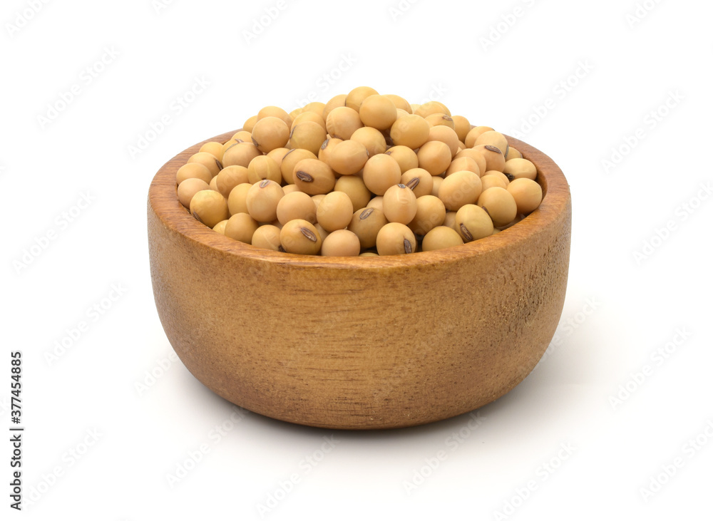 Soybean seeds in a wooden bowl isolated on white background,Agricultural products. Soybean seeds in a wooden bowl isolated on white background,Agricultural products.