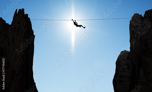 Wallpaper Mural Man balancing on the rope concept of challenge and risk taking Torontodigital.ca