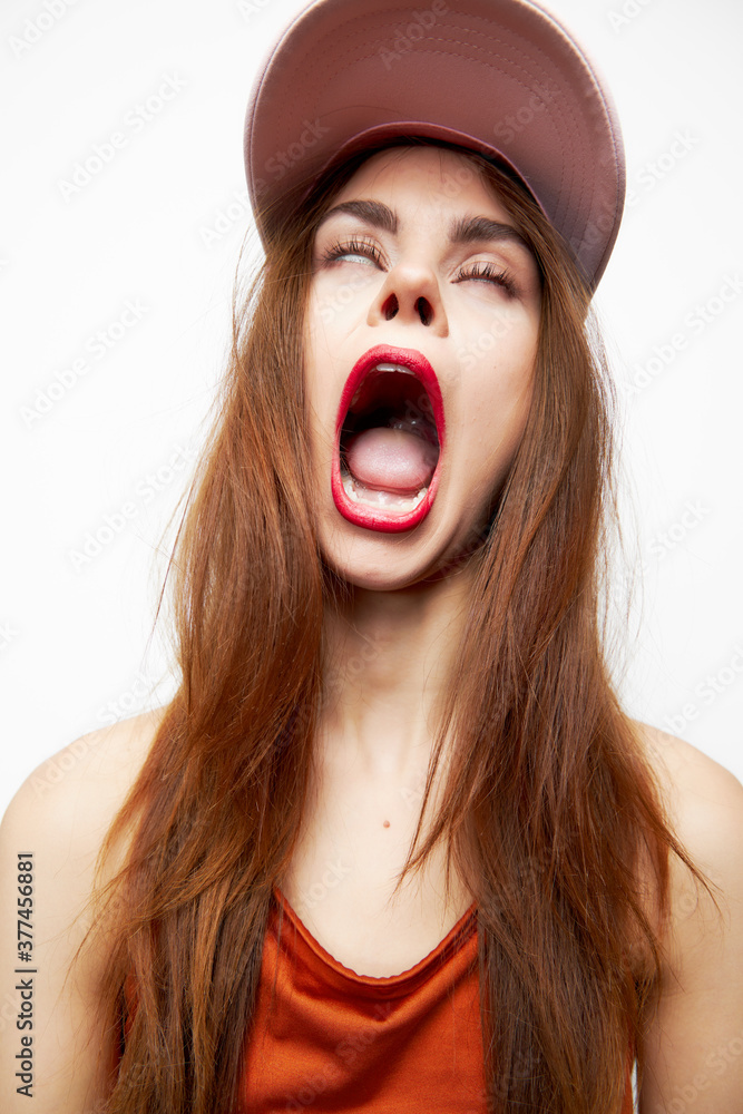 Woman with a cap Rolls his eyes wide open mouth on her head sexy Woman with a cap Rolls his eyes wide open mouth on her head sexy