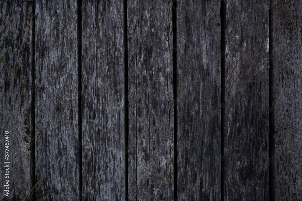 texture of an even row of old gray rotten boards texture of an even row of old gray rotten boards
