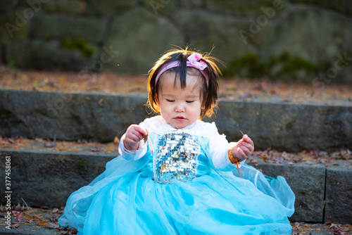 girl in the autumn park on blue dress