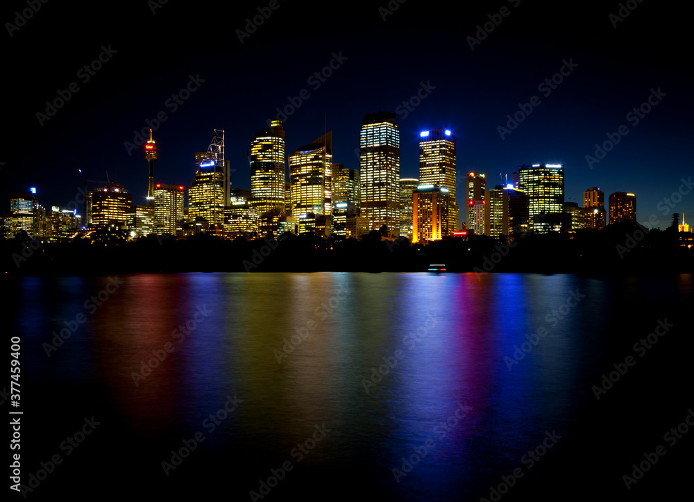 Sydney Skyline of the central business district with reflections in the bay waters.