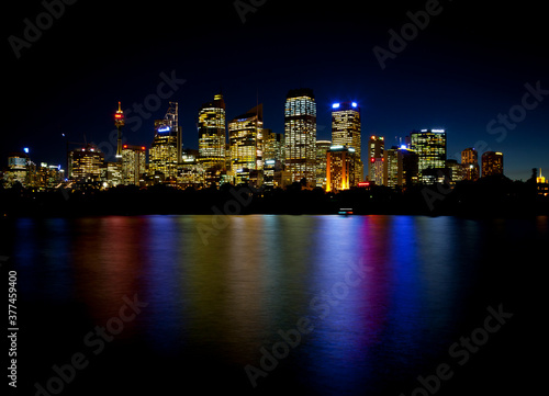 Sydney Skyline of the central business district with reflections in the bay waters. © Jason Bennee
