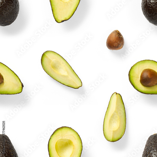 Modern creative avocado collage with simple text on solid color background. Avocado slices creative layout on White background. Flat lay, Food concept