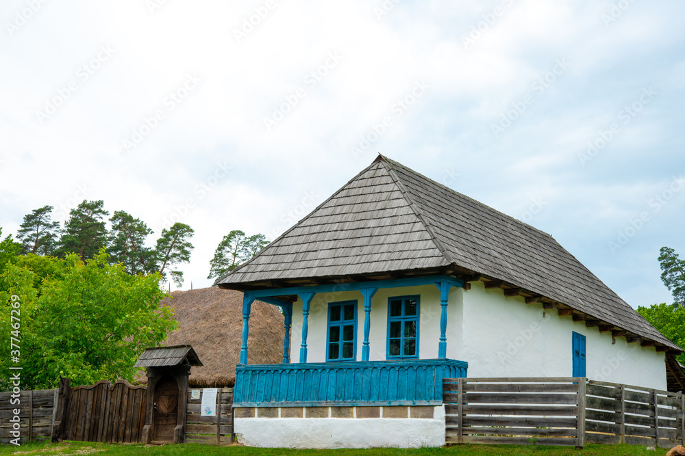 peasant house with thatched roof and tile built of clay and brick peasant house with thatched roof and tile built of clay and brick