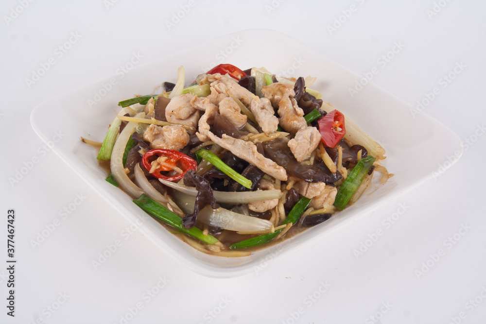 Stir fried chicken with spicy ginger, onion, shiitake mushroom and garlic on white plate. Asian style. Stir fried chicken with spicy ginger, onion, shiitake mushroom and garlic on white plate. Asian style.