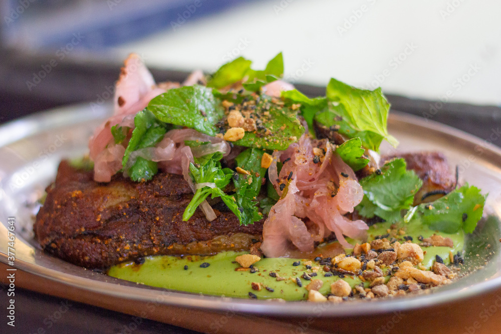 Roasted eggplant with green sauce