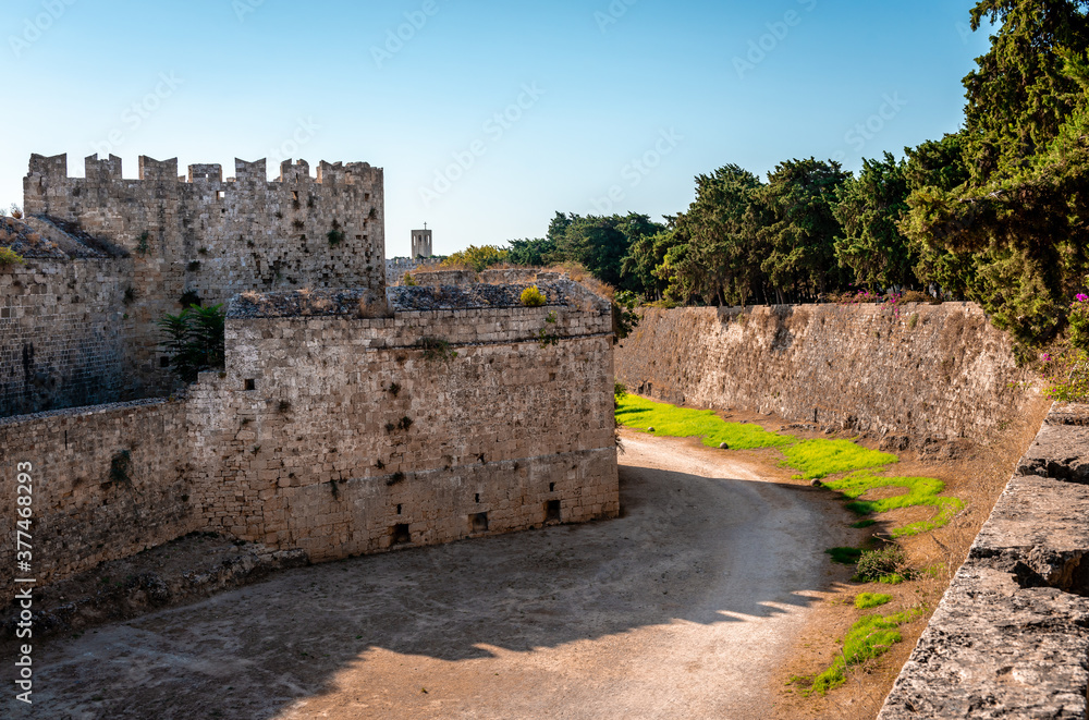The medieval moat and the city walls. Rhodes island, Greece.