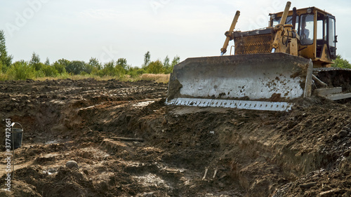 Excavator at mass grave archaeological site