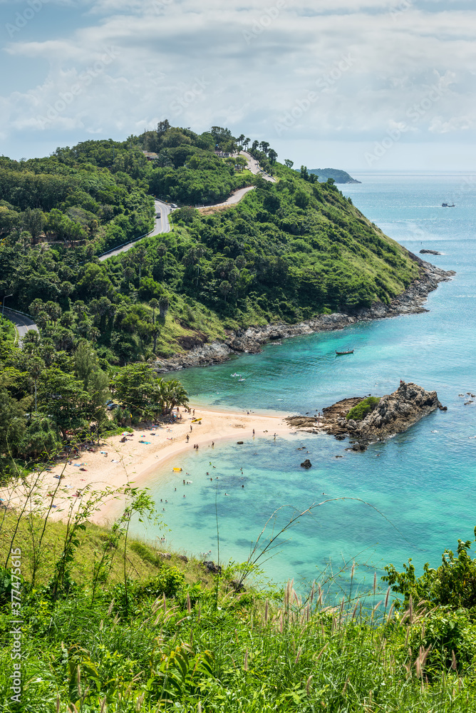 Birdview of beautiful quiet little cove landscape of Yanui Beach and Promthep Cape seen from the Windmill viewpoint located in the south of Phuket Island, Thailand.