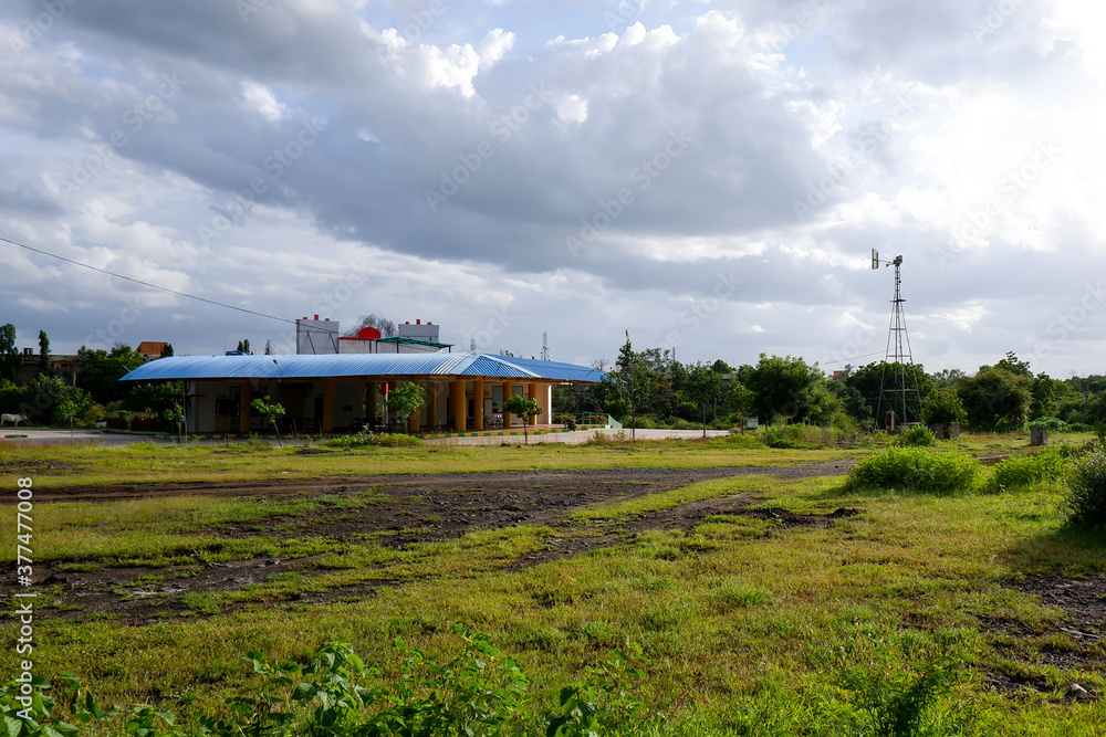 long view of city bus stand building isolated in nature