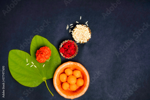 Indian festival dussehra , green leaf, rice and flowers photo