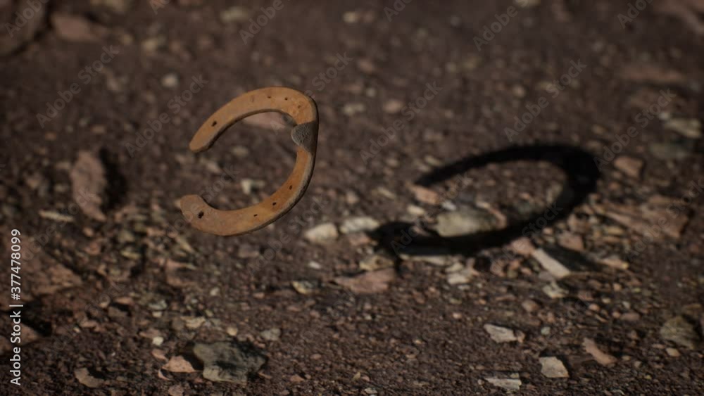 extreme slow motion old rusty metal horseshoe extreme slow motion old rusty metal horseshoe