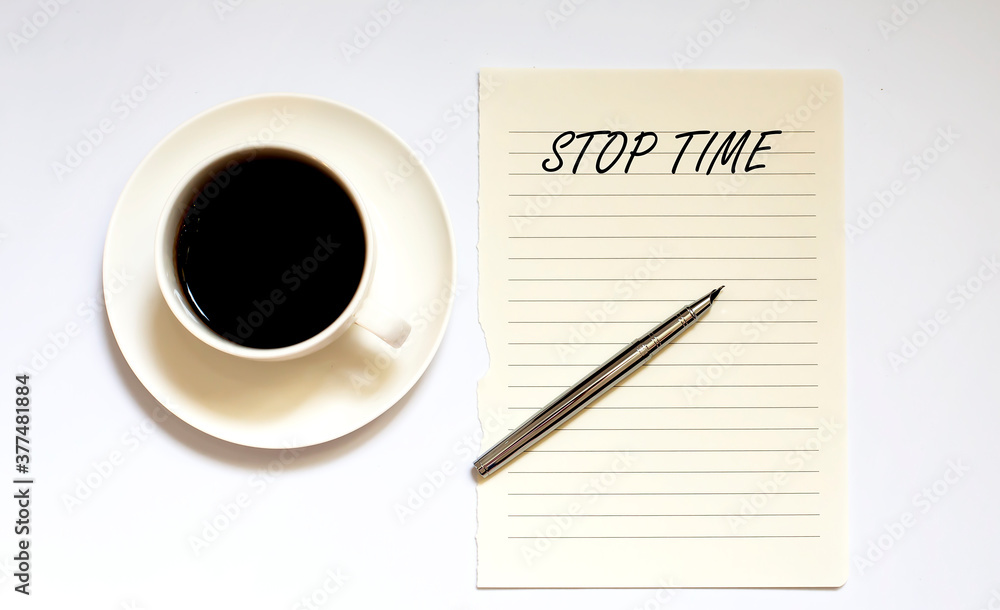 STOP TIME - white paper with pen and coffee on white background STOP TIME - white paper with pen and coffee on white background