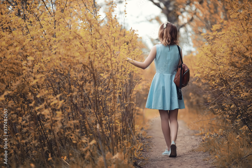 Young girl on a walk in the autumn Young girl on a walk in the autumn