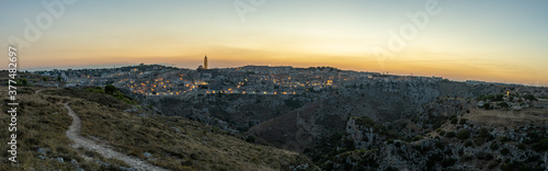 Panoramic view of the ancient city of Matera (Sassi di Matera) in the beautiful sunset light, blue hour, Basilicata, southern Italy