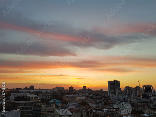 Sunset over Belgrade with orange-gray shades of the sky