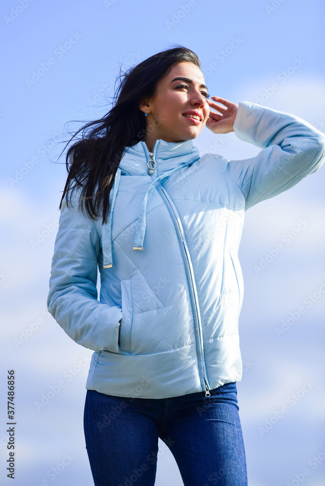 Freshness of morning. Explore your true style. Beauty and fashion look. Girl spring jacket blue sky background. Woman fashion model outdoors. Feel free windy day. Woman enjoying cool weather