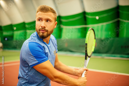 Professional tennis traner player playing a game photo