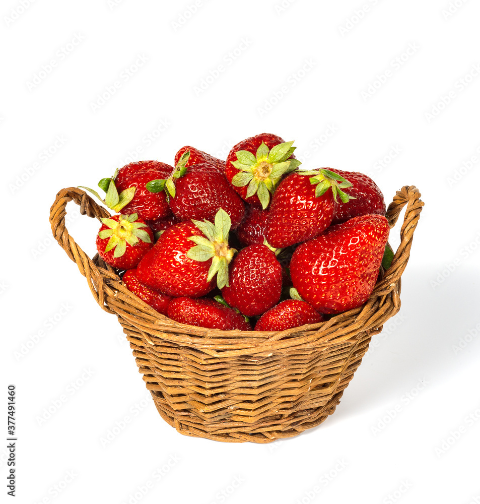 Strawberries and basket isolated on a white background. Strawberries and basket isolated on a white background.