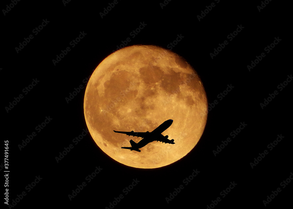 Flight Silhouette over the moon/ Planes flying in front of full moon/ Flight moves across full moon