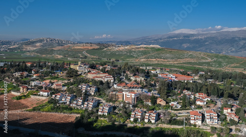View of the town of Metula, situated on the Israeli-Lebanese border, at the foot of Mount Hermon (in the background), as seen from Dado lookout point, Upper Galilee, Israel. © MoVia1