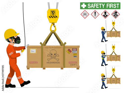 An industrial worker is moving hazardous material by crane.