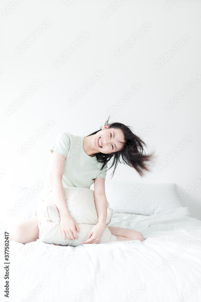 Asian women playing in the bedroom