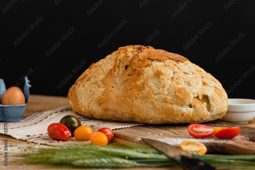 Bakery - gold rustic crusty loaves of bread. Still life captured from above (top view, flat lay).