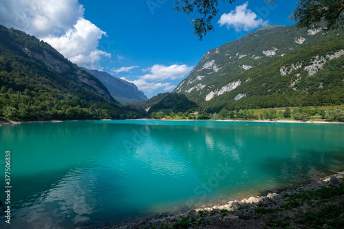 Tenno Lake in Trentino, Trento. Blue-green in color, a few kilometers from Riva del Garda can be reached via the wine and flavors route from Lake Garda or the Brenta Dolomites. Italy Alps.