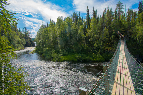 hanging bridge across river in Finland photo