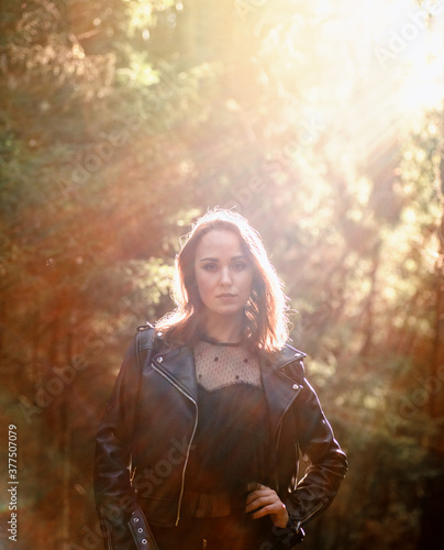 Outdoor fashion photo of young beautiful lady in a birch forest.
