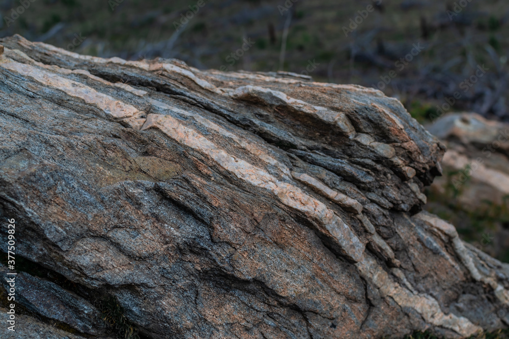 layered multi-colored gray stone in Baikal nature on a cloudy day layered multi-colored gray stone in Baikal nature on a cloudy day